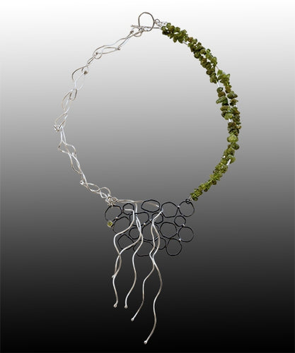 Necklace in sterling silver and peridot, reflecting Tasmanian flora, fungi and kelp. Made by Adelaide silversmith Suzette Watkins