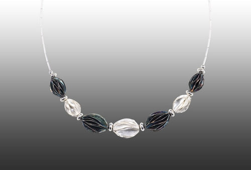 Necklace of sterling silver and patinated sterling silver, representing outback central Australia.  Made by Adelaide silversmith Suzette Watkins